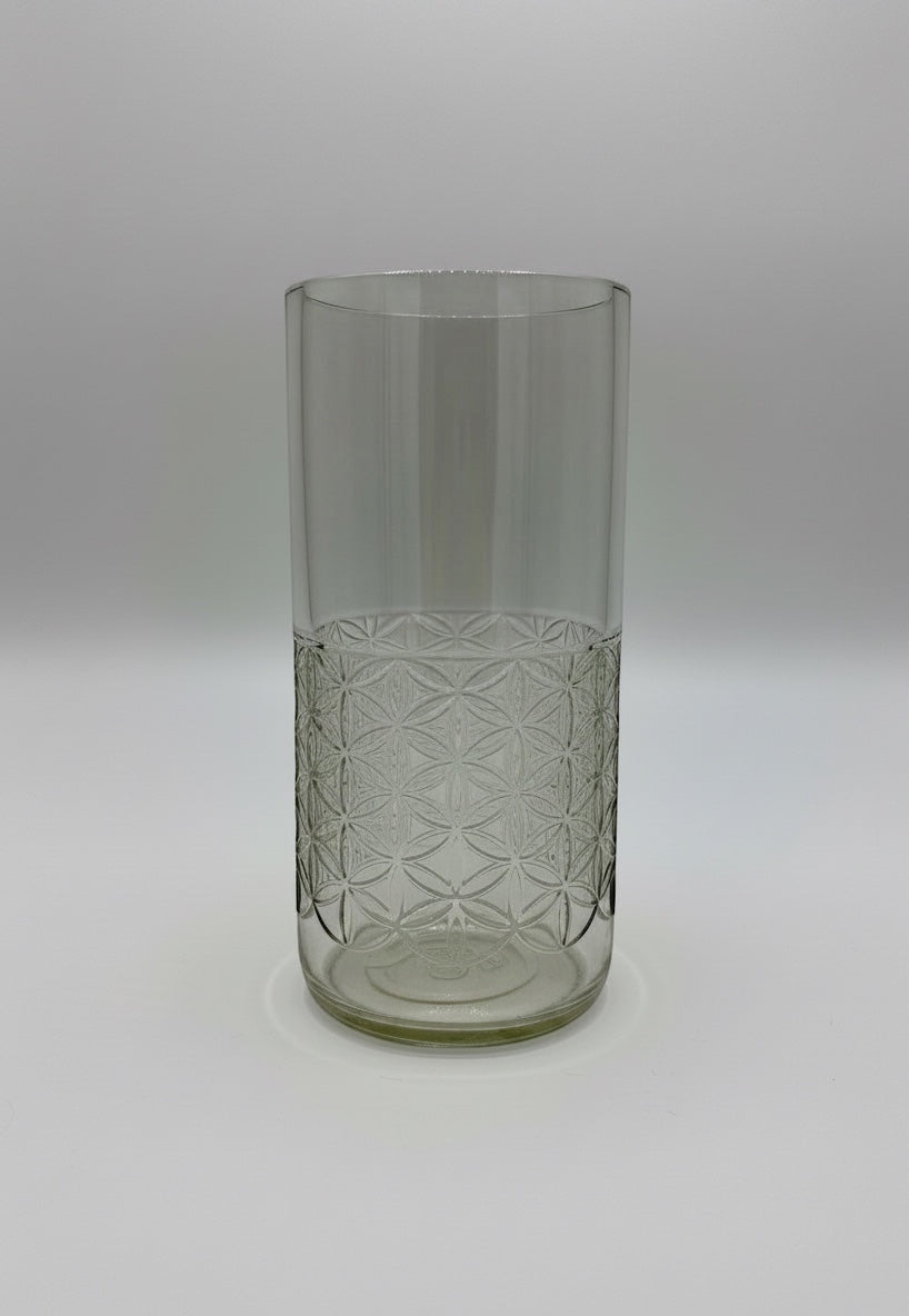 Broken Arrow Glass Recycling clear upcycled glass tumbler featuring an embossed geometric flower of life pattern.