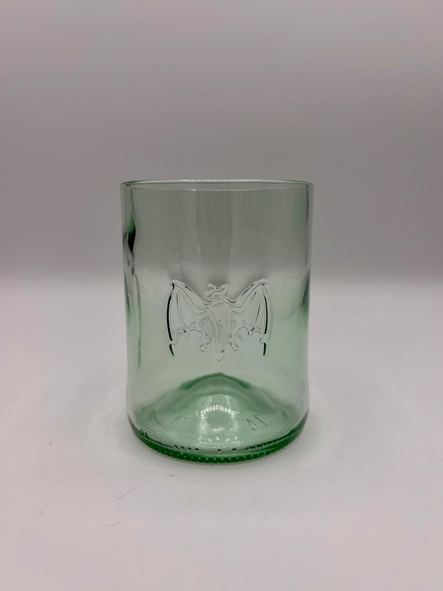 Broken Arrow Glass Recycling upcycled Bacardi bottle tumbler in sea glass green with embossed bat logo